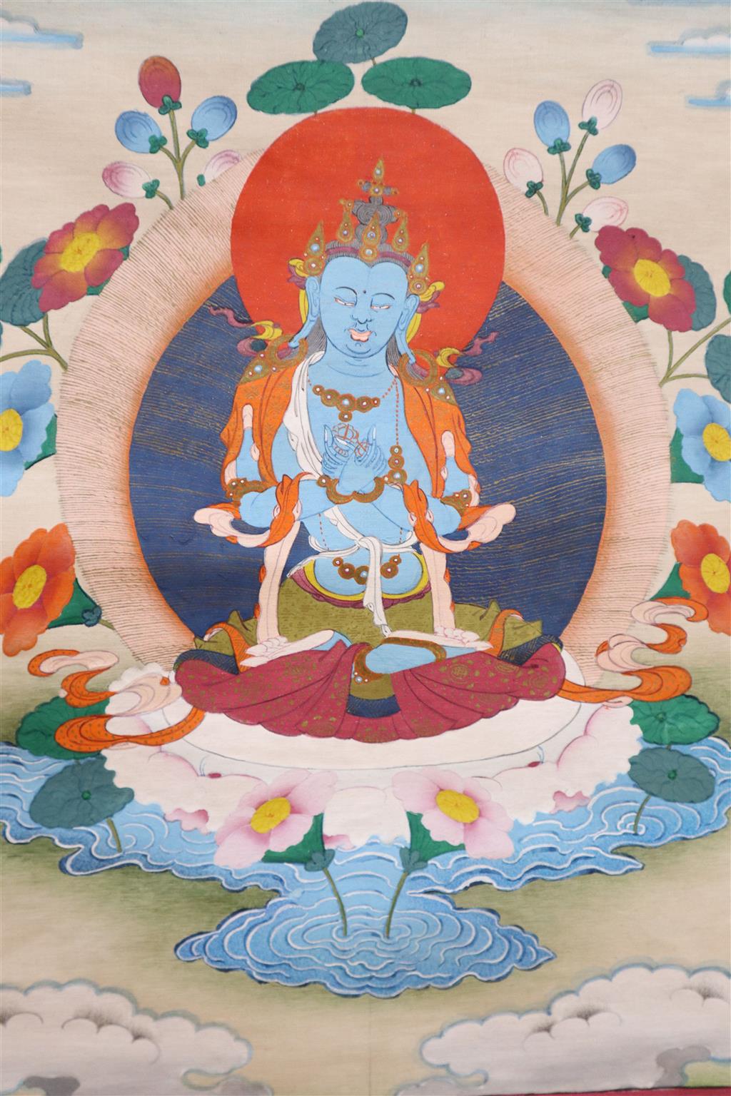 A Thai bronze votive plaque and a Tibetan thangka painting